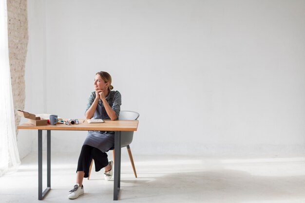 Lovely female artist sitting copy space