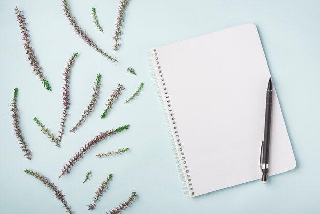 Lovely flowers concept with modern notebook