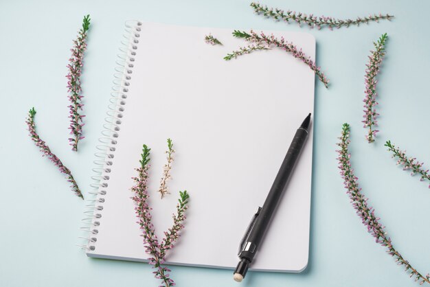 Lovely flowers concept with modern notebook