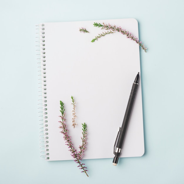 Lovely flowers concept with modern notebook
