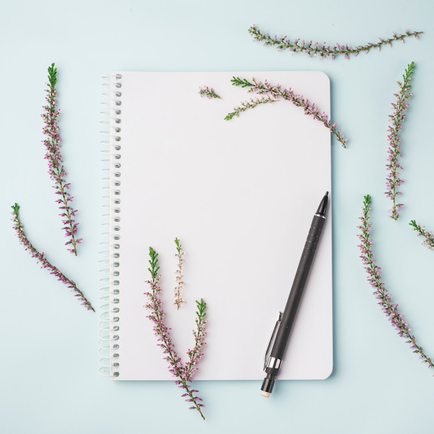 Lovely flowers concept with notebook