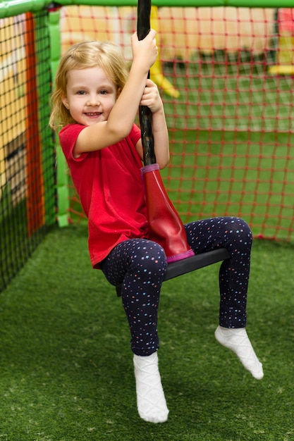 Free photo lovely girl enjoying playground