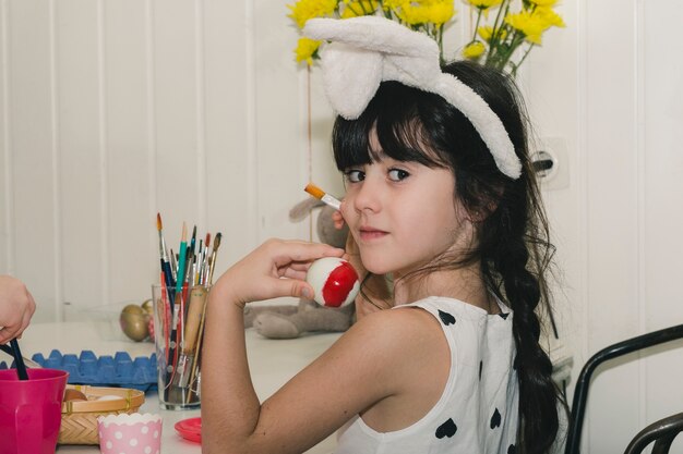 Lovely girl showing Easter egg