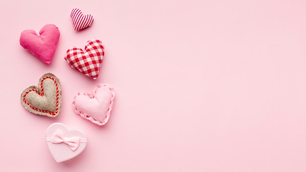 Lovely hearts on pink background with copy space