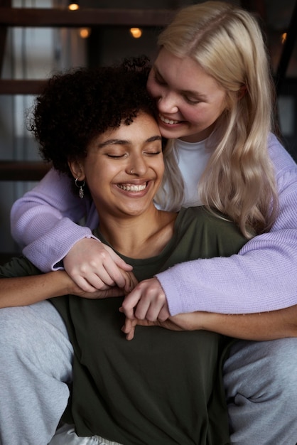 Lovely lesbian couple being affectionate at home