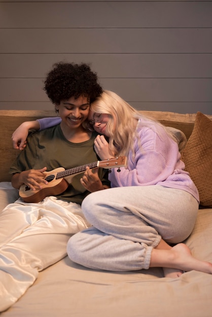 Free photo lovely lesbian couple being affectionate at home