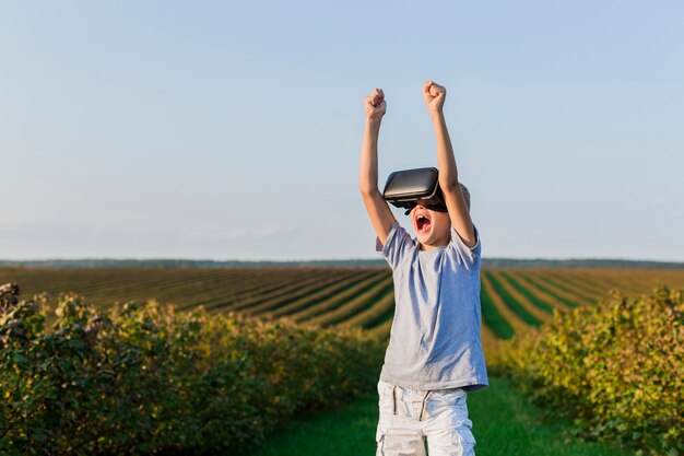 Lovely little boy having fun with virtual reality glasses