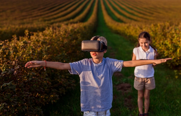 Lovely little boy having fun with virtual reality glasses