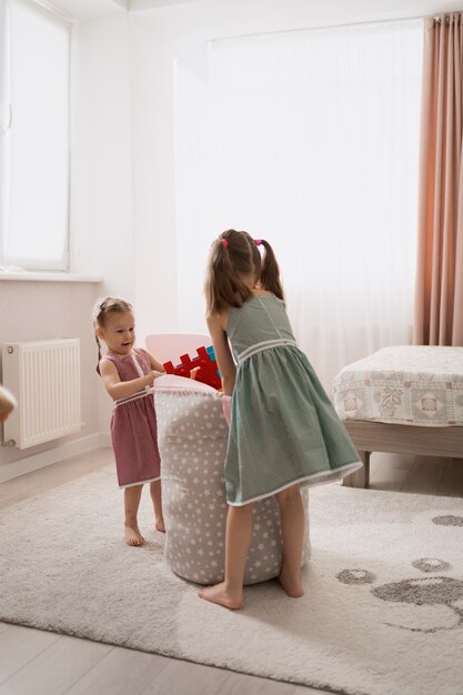 Lovely little girls playing in their room