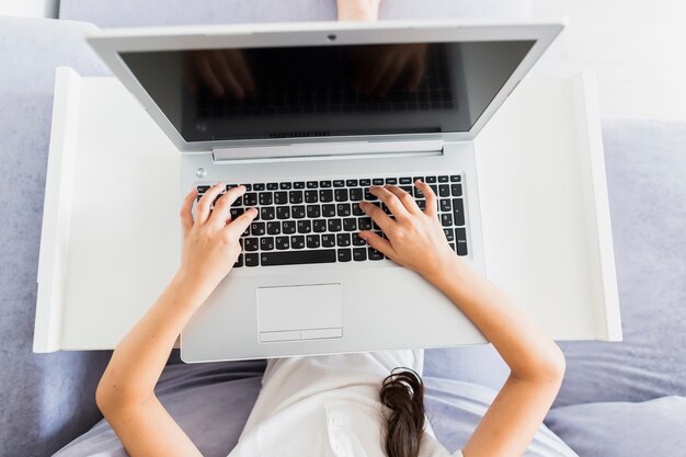 Lovely little girls using her laptop