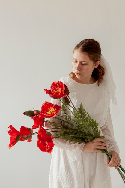 Lovely model holding beautiful flowers