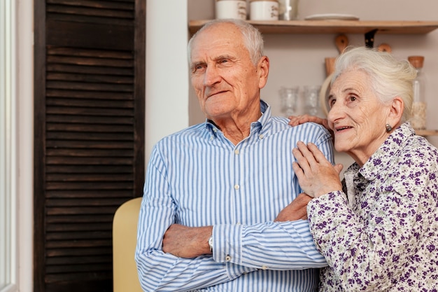 Lovely senior couple looking away