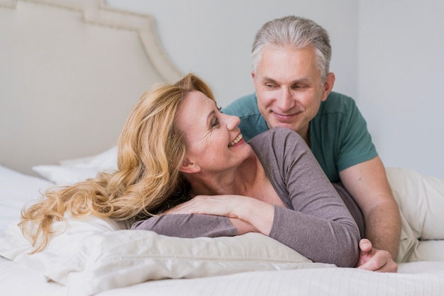 Lovely senior man and woman smiling