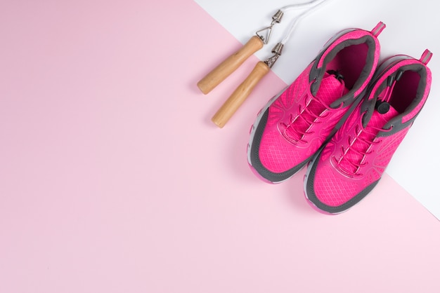 Free photo lovely sport composition with skipping rope and trainers