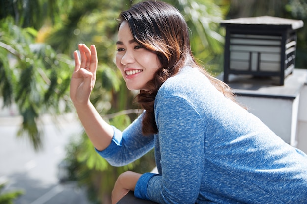 Free photo lovely waving woman