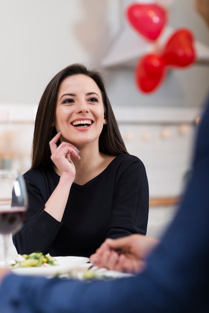 Lovely woman looking at her husband