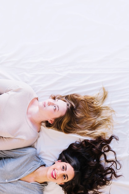 Lovely women on white sheet