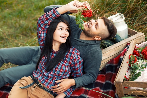 Lovely young couple having fun on the grass