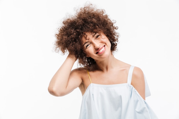 Free photo lovely young lady with curly hair looking