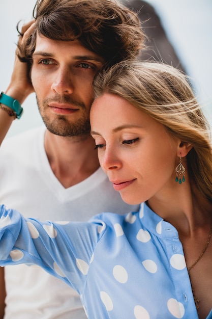 Lovely young stylish hipster couple in love on tropical beach during vacation