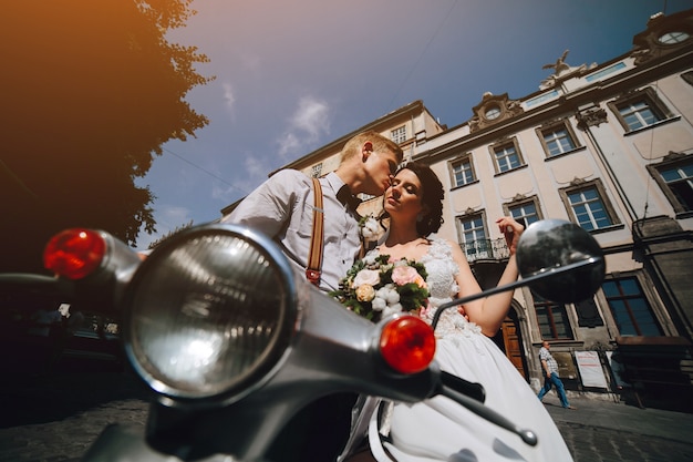 Loving couple on the bike