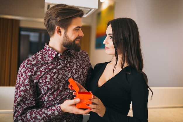 Loving couple celebrating holiday at home