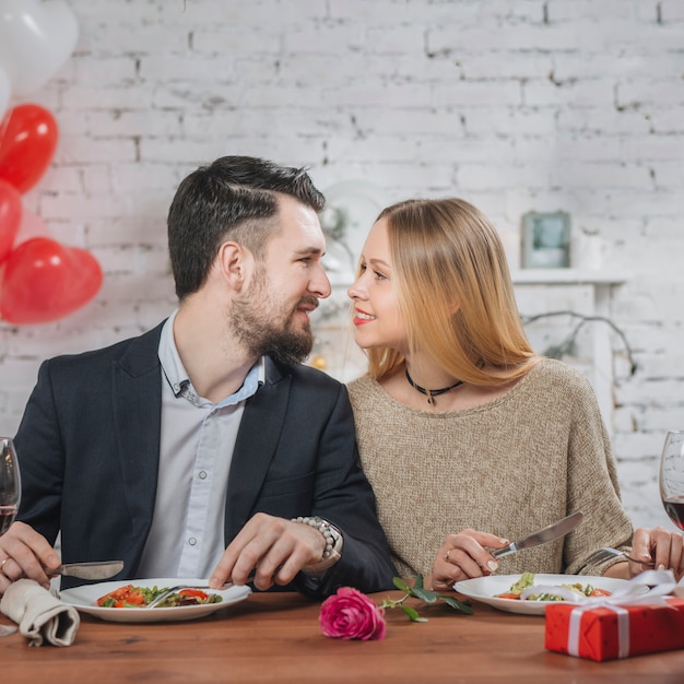 Loving couple at dinner table