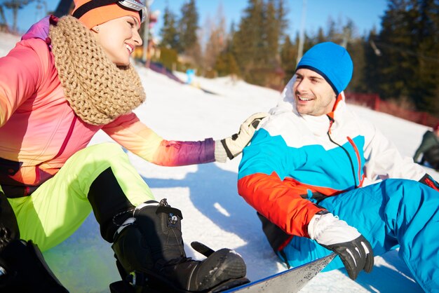 Loving couple having so much fun skiing 
