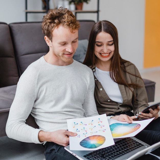 Loving couple planning to redecorate the house