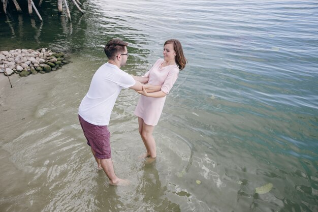 Loving couple playing in the water