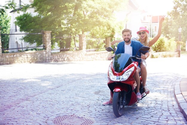 Loving couple riding a motorbike