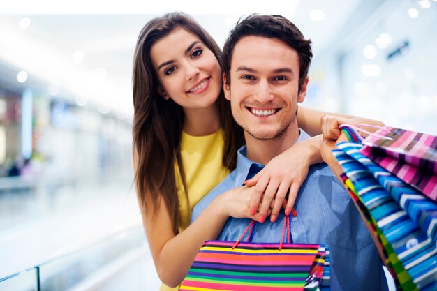 Loving couple in shopping mall