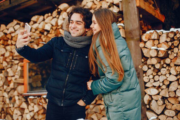 Loving couple standing in a winter park