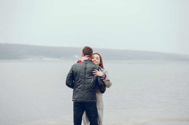 Loving couple walking around the river.