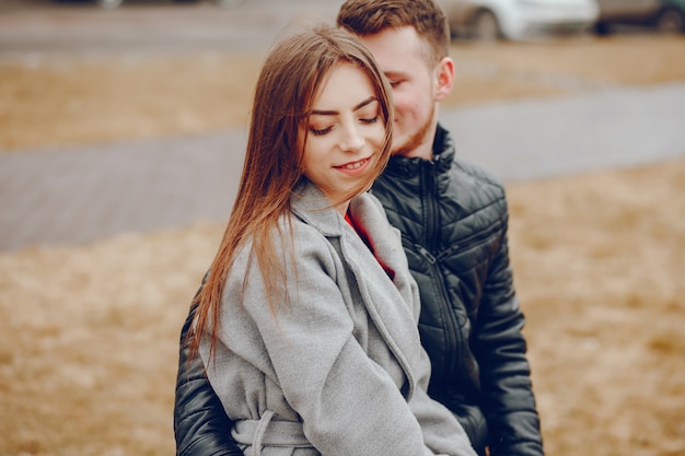 Free photo loving couple walking around the river.