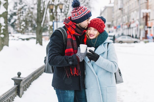 Loving couple walking in winter city