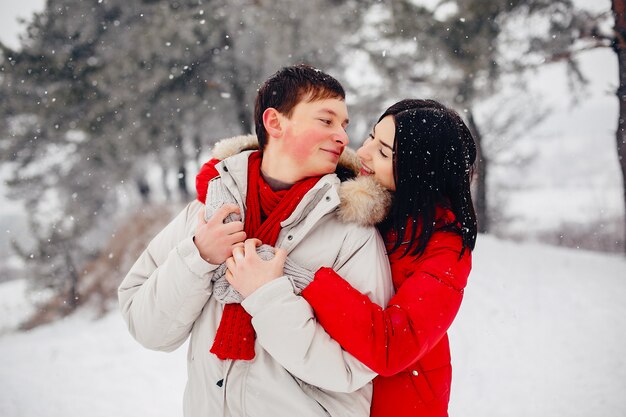 Loving couple walking in a winter park