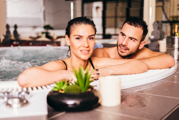 Couple Enjoying Jacuzzi Hot Tub Bubble Bath Premium Photo