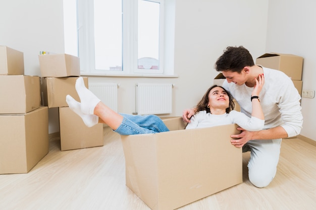 Loving young home owners enjoying relocation in new home
