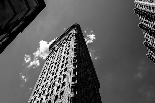 Low angle black and white shot of the Flatiron building in NYC