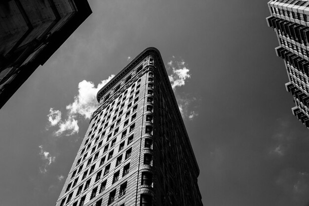 Low angle black and white shot of the Flatiron building in NYC