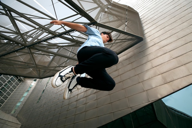 Low angle boy doing parkour