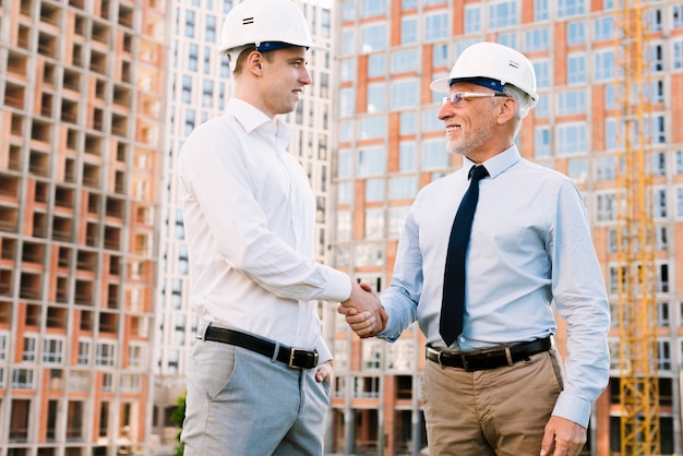 Low angle businessmen making an agreement