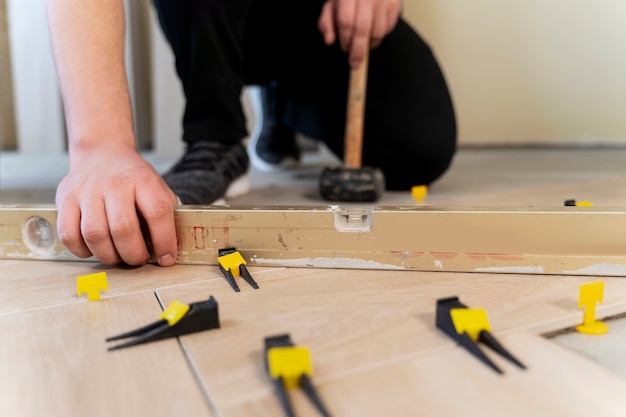 Low angle contractor tiling floor