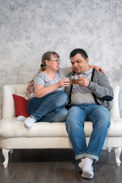 Low angle couple drinking tea