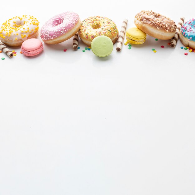 Low angle donuts on plain background