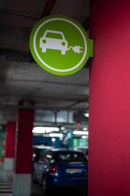 Free photo low angle electric car charging sign