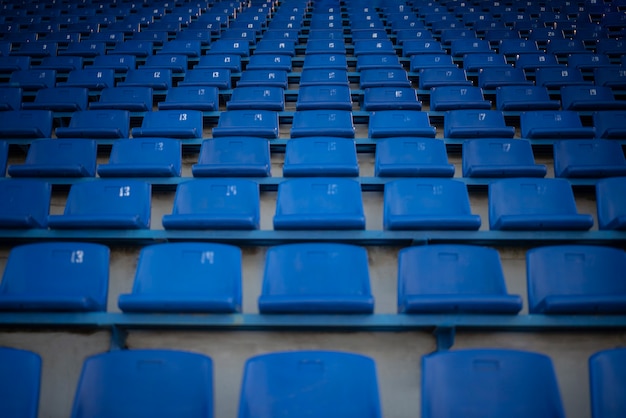 Low angle empty blue grandstands