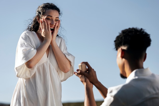 Low angle excited woman accepting proposal