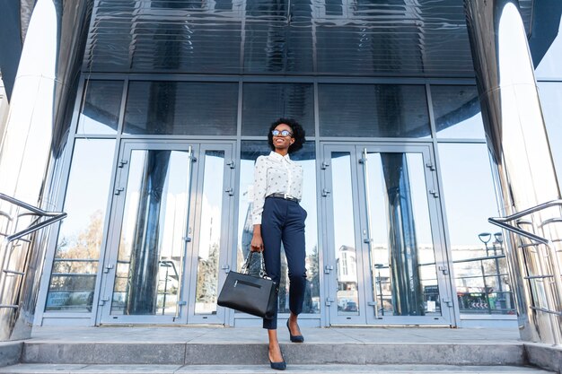 Low angle fashionable woman with handbag